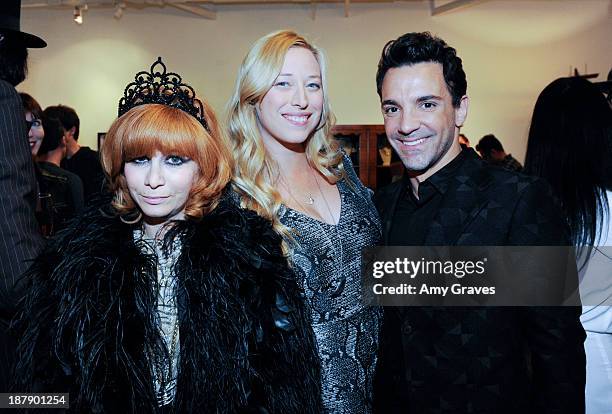 Linda Ramone, Beth Yorn and George Kotsiopoulos attend the Beth Yorn Photography Show at Roseark on November 7, 2013 in West Hollywood, California.