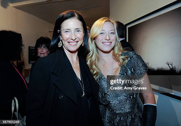 Mimi Rogers and Beth Yorn attend the Beth Yorn Photography Show at Roseark on November 7, 2013 in West Hollywood, California.