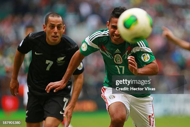 Jesus Escoboza of Mexico struggles for the ball with Leo Bertos of New Zealand during a match between Mexico and New Zealand as part of the FIFA...