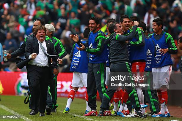 Miguel Herrera, head coach of Mexico celebrates during a match between Mexico and New Zealand as part of the FIFA World Cup Qualifiers at Azteca...