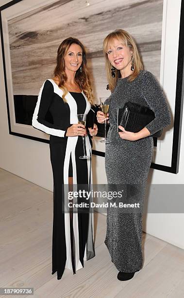 Yvonne Krzywkowska and Nina Bialoguski attend the private view of ENCOUNTER the stunning wildlife photography of David Yarrow at Saatchi Gallery on...