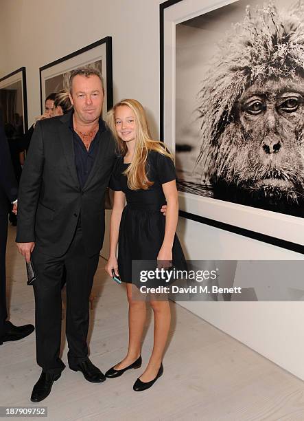 David Yarrow and Jade Yarrow attend the private view of ENCOUNTER the stunning wildlife photography of David Yarrow at Saatchi Gallery on November...