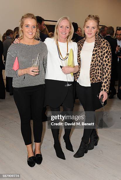 Guests attend the private view of ENCOUNTER the stunning wildlife photography of David Yarrow at Saatchi Gallery on November 13, 2013 in London,...