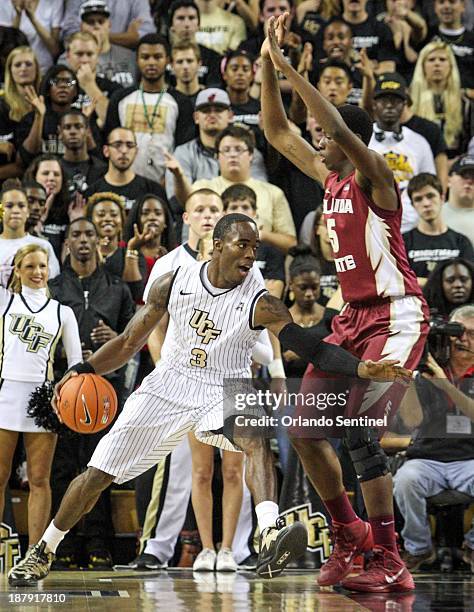 Isaiah Sykes of the Central Florida Knights drives to the basket against Jarquez Smith of the Florida State Seminoles during first-half action at CFE...