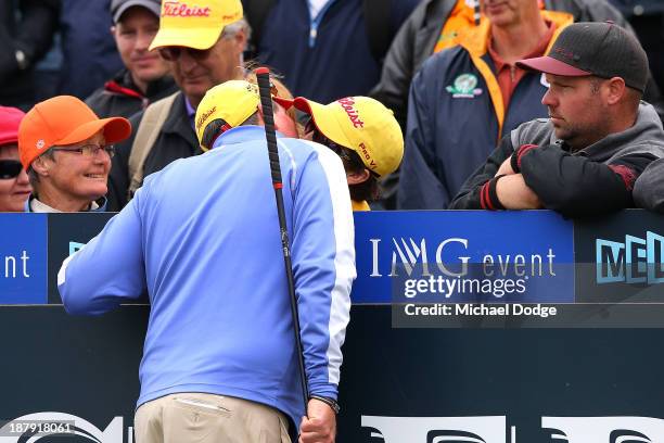 Jarrod Lyle of Australia kisses his wife Brioni Lyle on the first tee before his shot during round one of the 2013 Australian Masters at Royal...