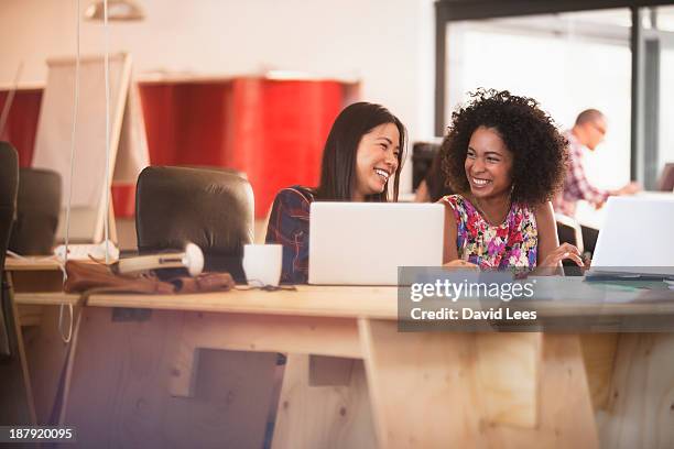 business people using laptops in modern office - head shot close looking stockfoto's en -beelden