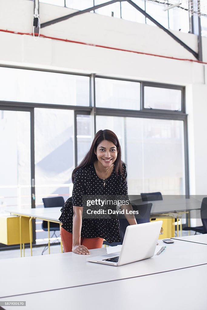 Smiling businesswoman in modern office