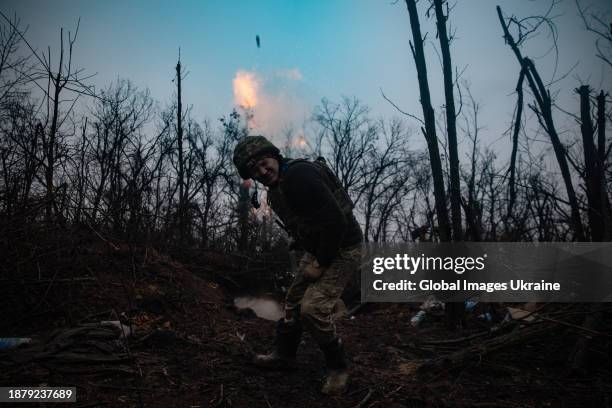 Ukrainian soldier fires a mortar on December 23, 2023 in Donetsk Oblast, Ukraine.