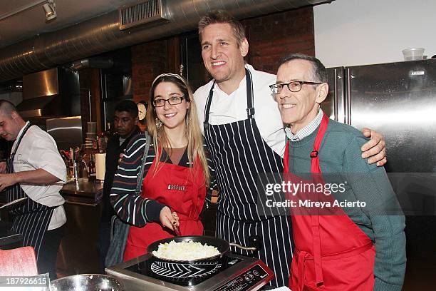 Chef Curtis Stone and participants attend the Cooking with Curtis Stone and Netflix event at Miette Culinary Studio on November 13, 2013 in New York...