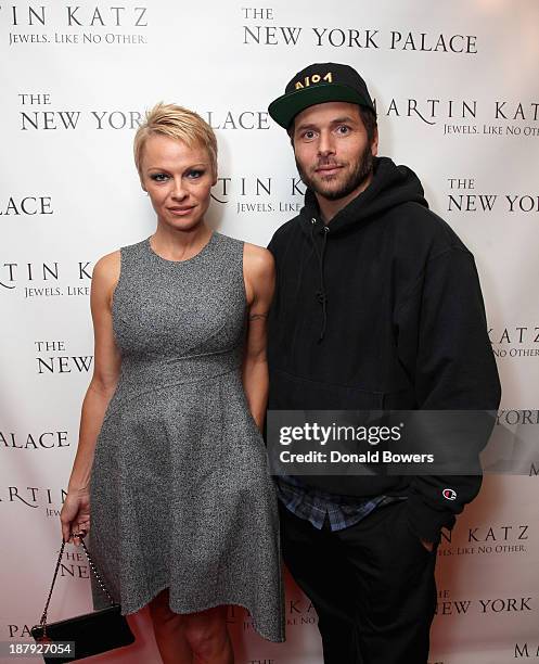 Pamela Anderson and Rick Salomon attend The Martin Katz Jewel Suite Debuts At The New York Palace Hotel on November 13, 2013 in New York City.