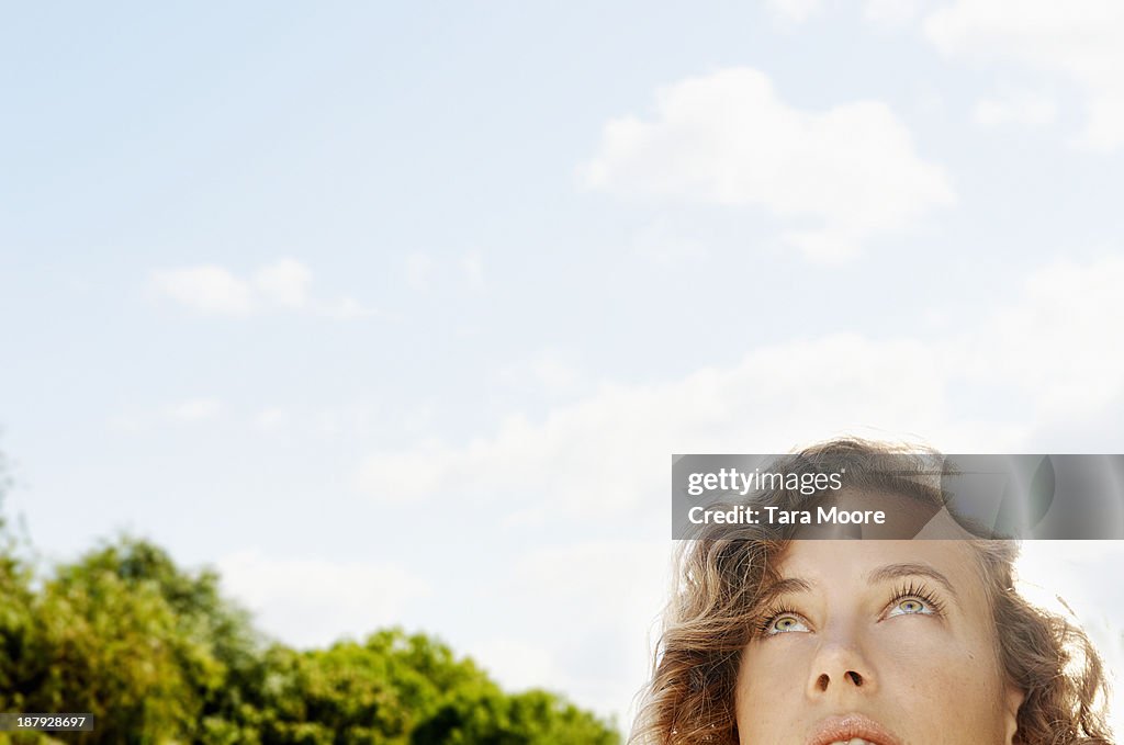 Woman's face looking up to sky