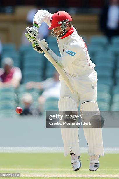 Phillip Hughes of the Redbacks bats during day two of the Sheffield Shield match between the Redbacks and the Warriors at Adelaide Oval on November...