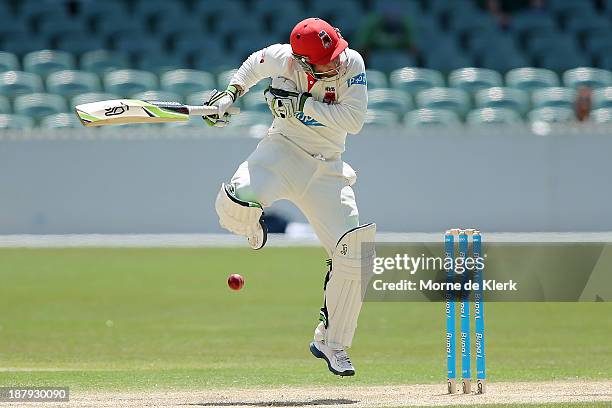 Phillip Hughes of the Redbacks plays a short ball during day two of the Sheffield Shield match between the Redbacks and the Warriors at Adelaide Oval...