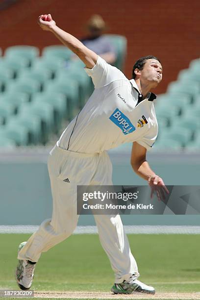 Nathan Coulter-Nile of the Warriors bowls duringday two of the Sheffield Shield match between the Redbacks and the Warriors at Adelaide Oval on...