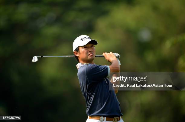 Kodai Ichihara of Japan plays a shot during round one of the Resorts World Manila Masters at Manila Southwoods Golf and Country Club on November 14,...