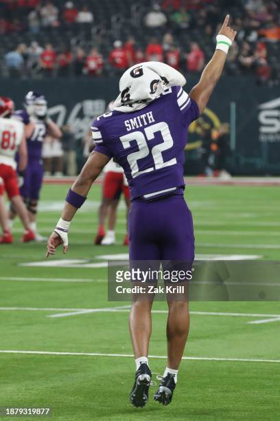 Defensive back Evan Smith of the Northwestern Wildcats celebrates his teams 14-7 victory over the Utah Utes at the conclusion of the SRS Distribution...