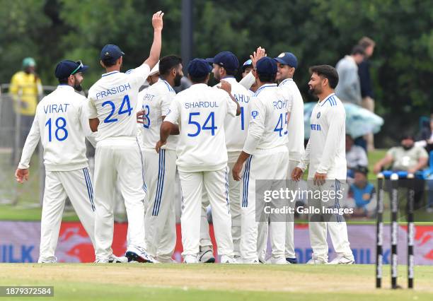 Indian players celebrate the dismissal of Tony de Zorzi of South Africa during day 2 of the 1st test match between South Africa and India at...