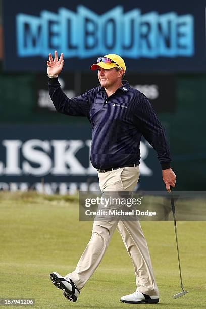 Jarrod Lyle of Australia waves to the crows on the 18th hole during round one of the 2013 Australian Masters at Royal Melbourne Golf Course on...