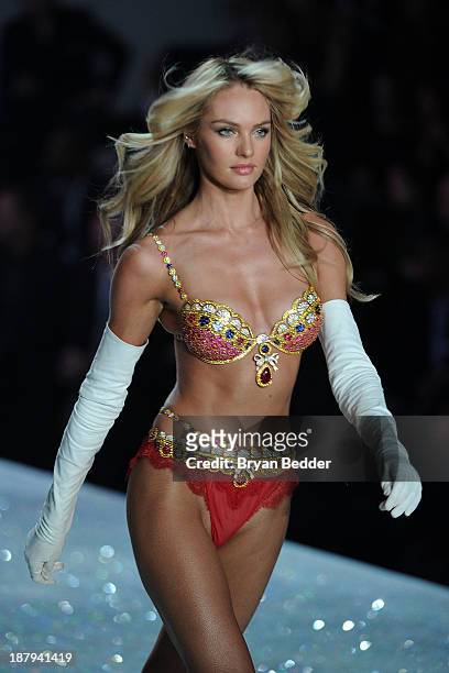 Model Candice Swanepoel, wearing the Royal Fantasy Bra and Belt, walks the runway at the 2013 Victoria's Secret Fashion Show on November 13, 2013 in...