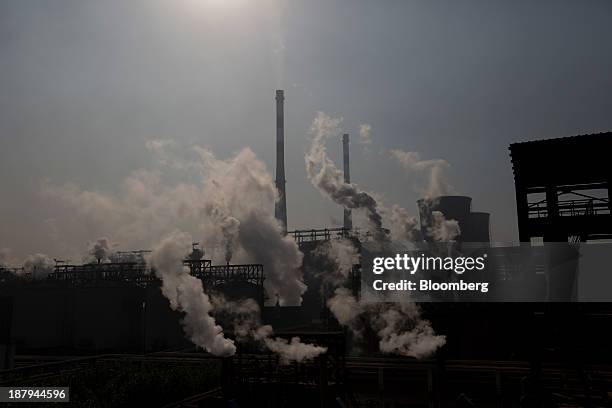 Vapor rises at the China Hongqiao Group Ltd. Aluminum smelting facility in Zouping, China, on Monday, Nov. 4, 2013. China Hongqiao Group is China's...
