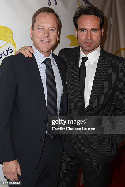 Actors Kiefer Sutherland and Jason Patric arrive at the "Stand Up for Gus" benefit at Bootsy Bellows on November 13, 2013 in West Hollywood,...
