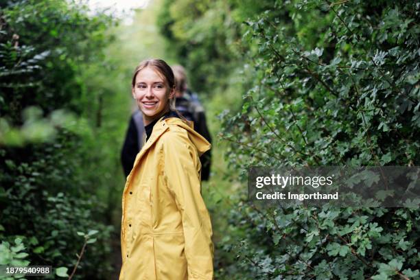 teenagers hiking in the cotswolds, gloucestershire, united kingdom - girl looking over shoulder stock pictures, royalty-free photos & images