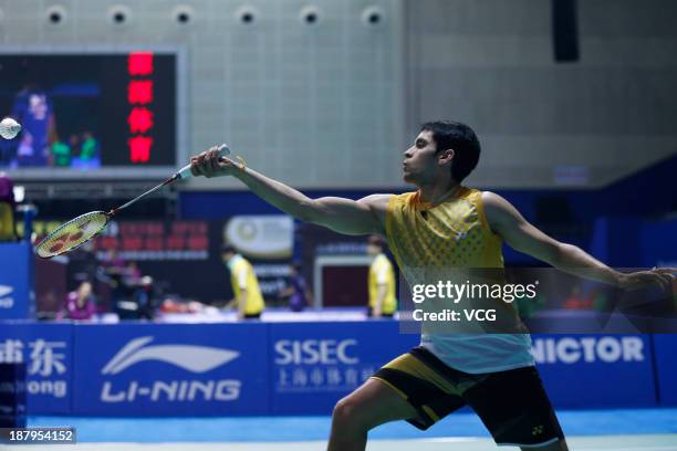 Kashyap Parupalli of India competes against Kento Momota of Japan during the men's singles match on day three of China Open 2013 at Yuanshen...