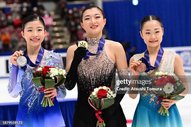 Mone Chiba , Kaori Sakamoto and Mao Shimada of Japan pose with medals during day four of the 92nd All Japan Figure Skating Championships at Wakasato...