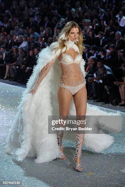 Model Magdalena Frackowiak walks the runway wearing bodysuit using Swarovski Crystals at the 2013 Victoria's Secret Fashion Show at Lexington Avenue...