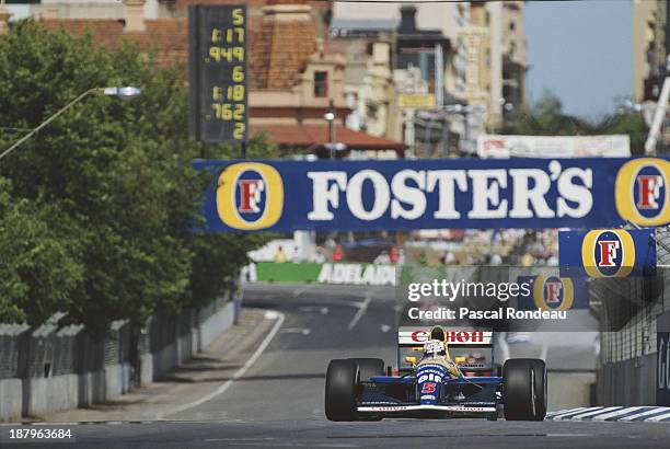 Nigel Mansell of Great Britain drives the Canon Williams Renault Williams FW14 Renault RS3 V10 during practice for the Formula One Foster's...