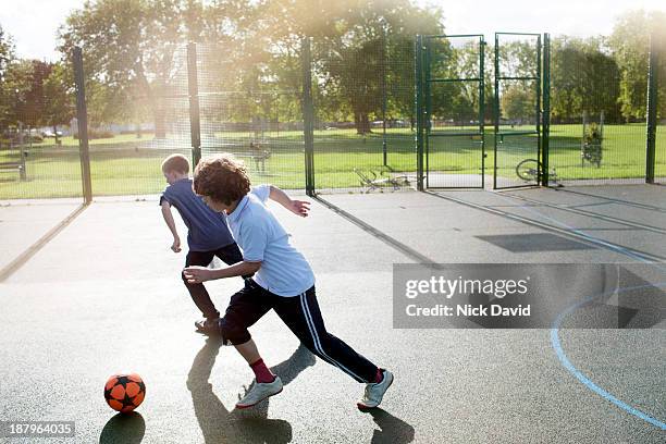 boys playing outside in the park - junior high age stock pictures, royalty-free photos & images