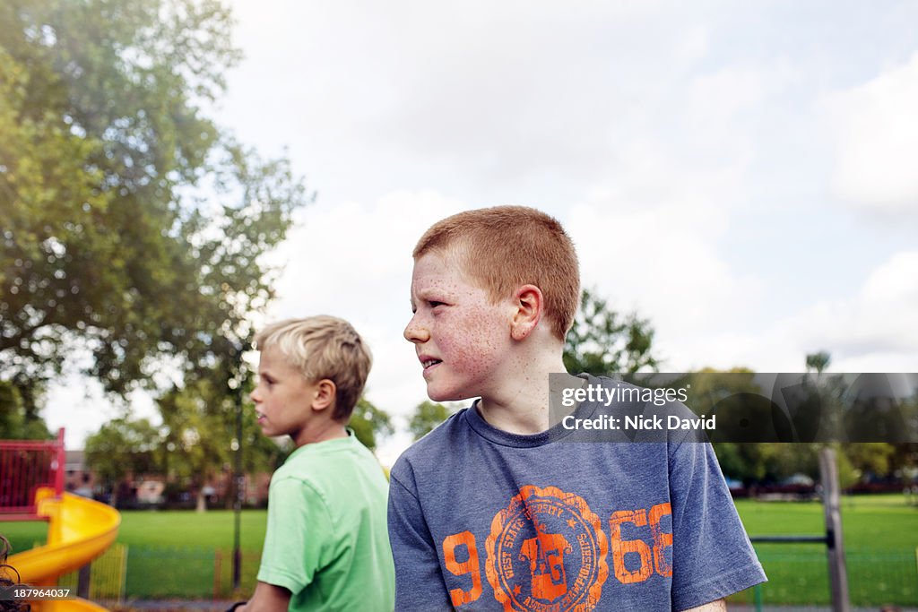 Boys playing outside in the park