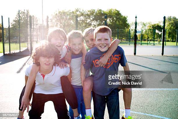 boys playing outside in the park - only boys stock pictures, royalty-free photos & images