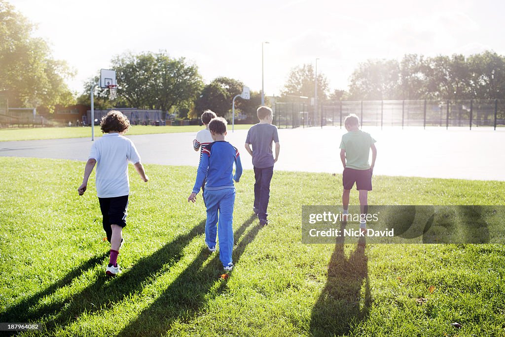 Boys playing outside in the park