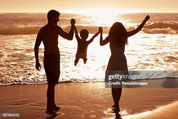 one happy family - sunset beach hawaii stock pictures, royalty-free photos & images