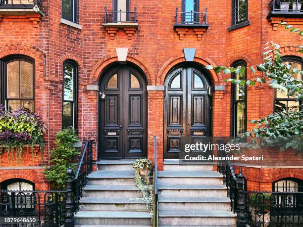 door entrance of the red brick row house in brooklyn heights, new york city, usa - new york apartment building exterior stock pictures, royalty-free photos & images
