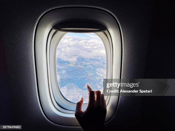 touching plane window during flight, personal perspective view - personal perspective or pov stock pictures, royalty-free photos & images