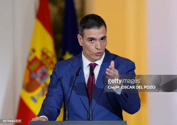 Spain's Prime Minister Pedro Sanchez gestures as he gives a press conference at La Moncloa Palace in Madrid on December 27, 2023 following the last...