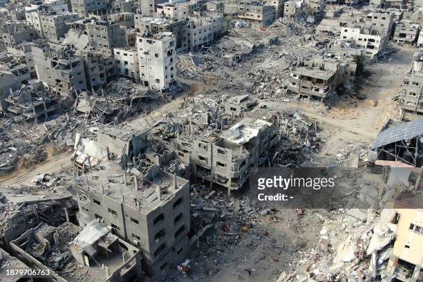 An aerial view on December 26, 2023 shows destroyed buildings in Beit Lahia following Israeli bombardments in the northern Gaza Strip, amid ongoing...