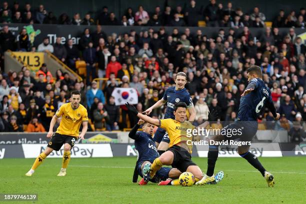 Hwang Hee-Chan of Wolverhampton Wanderers is challenged by Levi Colwill of Chelsea during the Premier League match between Wolverhampton Wanderers...