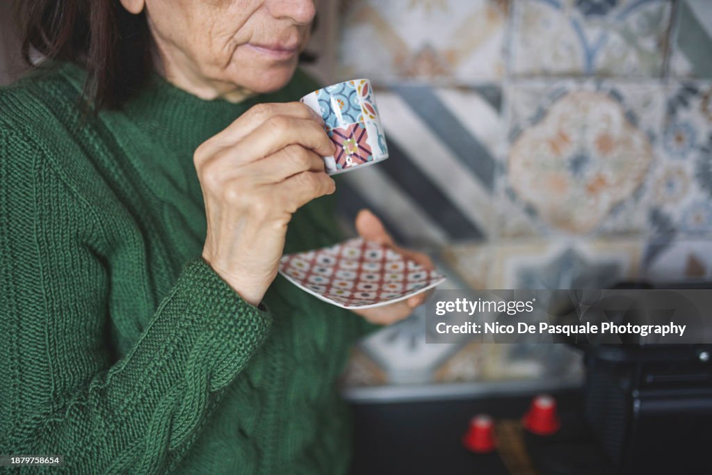 Senior Woman Drinking Cup Of Coffee At Home