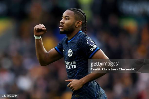 Christopher Nkunku of Chelsea celebrates after scoring their team's first goal during the Premier League match between Wolverhampton Wanderers and...