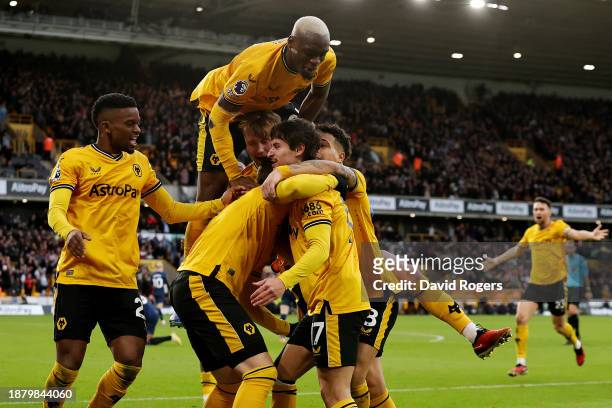 Matt Doherty of Wolverhampton Wanderers celebrates with team mates after scoring their sides second goal during the Premier League match between...