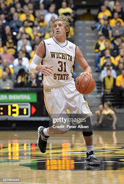 Guard Ron Baker of the Wichita State Shockers brings the ball up court against the Western Kentucky Hilltoppers during the first half on November 12,...