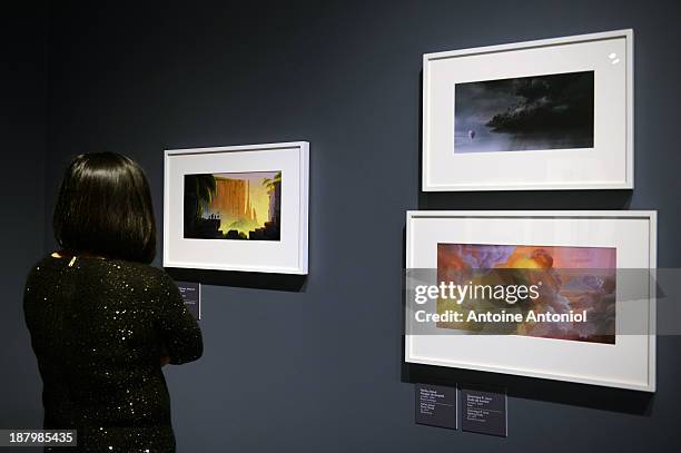 Visitor looks at storyboards from the film Up at 'Pixar, 25 years of Animation' exhibition on November 14, 2013 in Paris, France. The Art Ludique...