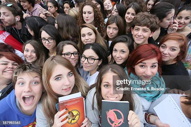 Fans wait hours before the 'The Hunger Games: Catching Fire' Premiere during The 8th Rome Film Festival at Auditorium Parco Della Musica on November...