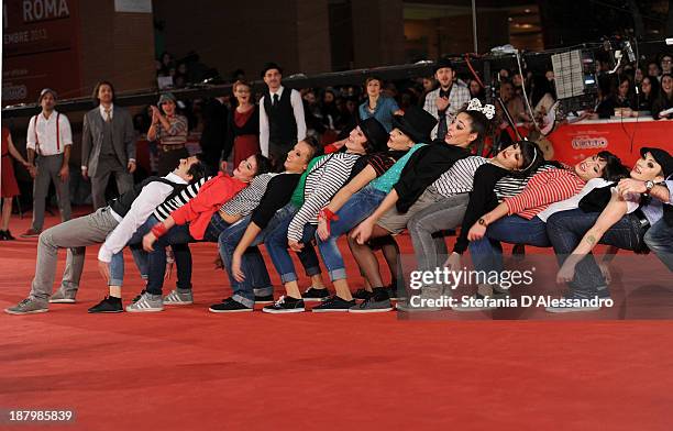 Dancers perform on the red carpet during The 8th Rome Film Festival on November 14, 2013 in Rome, Italy.