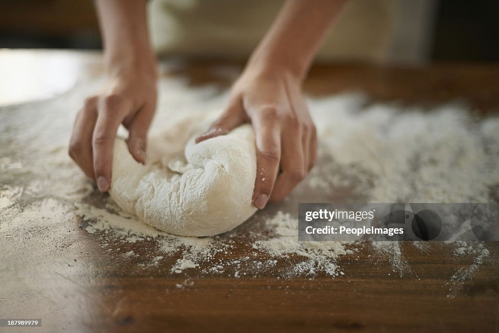 Gently working the dough