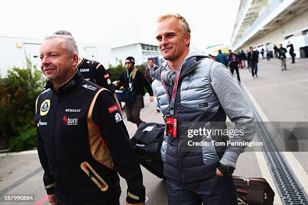 Heikki Kovalainen of Finland and Lotus arrives in the paddock during previews to the United States Formula One Grand Prix at Circuit of The Americas...