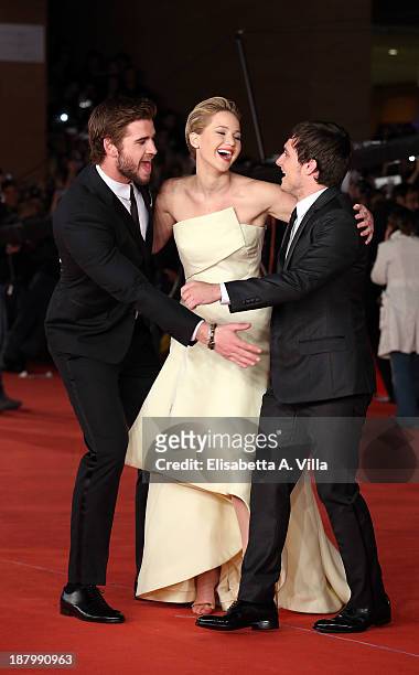 Actor Liam Hemsworth, actress Jennifer Lawrence and actor Josh Hutcherson attend 'The Hunger Games: Catching Fire' Premiere during The 8th Rome Film...
